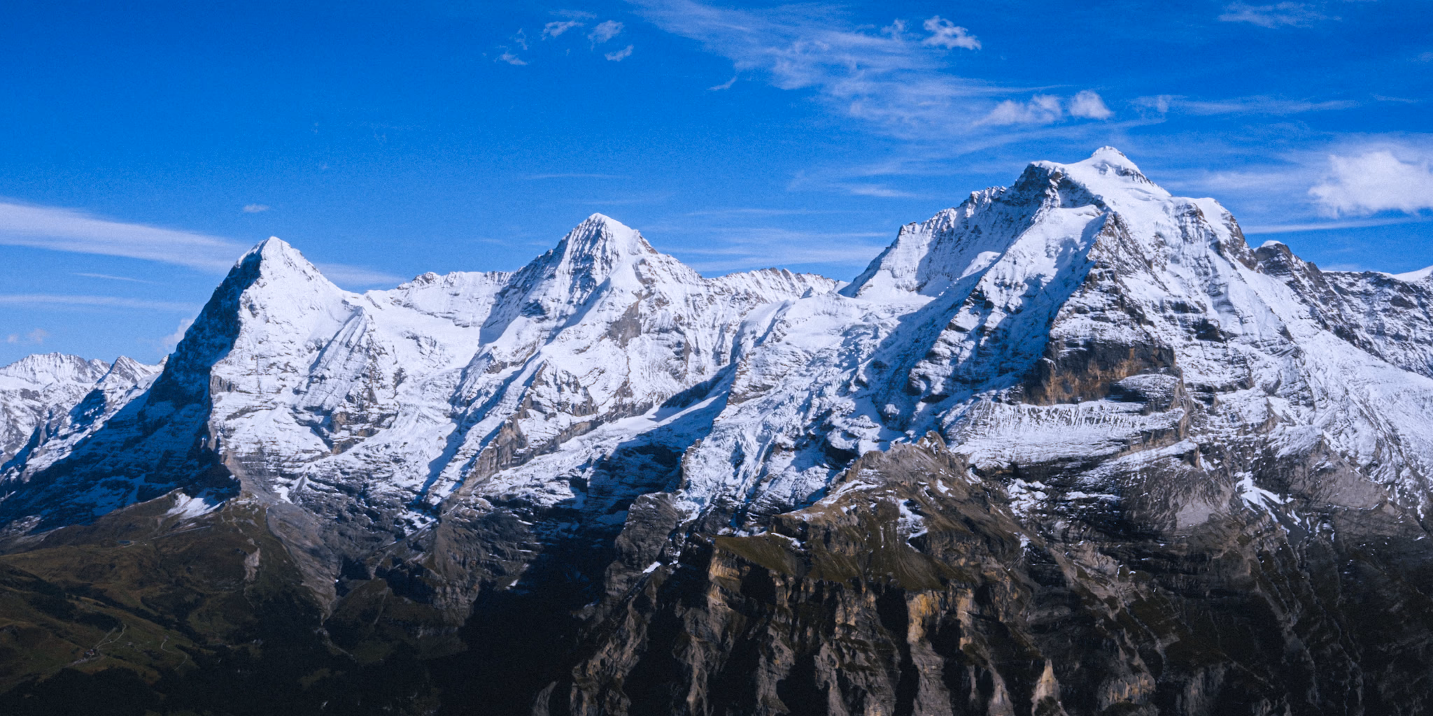 The iconic trio of Eiger, Mönch, and Jungfrau towering over the Bernese Oberland.